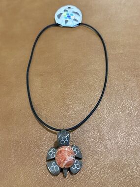 Marble Carved Turtle Pendant Necklace on Black Stretchy Cord.